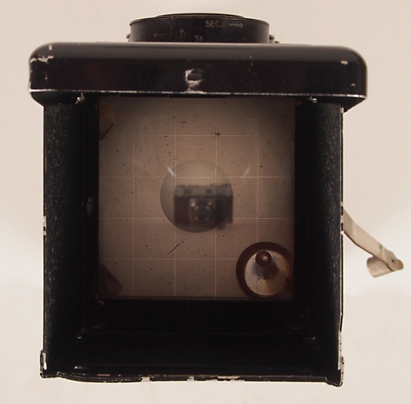 Looking through the prism you see everything in reverse. This is the 1930's version of an LCD screen.
